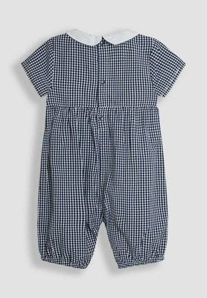 Námornícko-modrý a biely kockovaný overal s krátkymi rukávmi, okrúhlym bielym golierom a elastickými manžetami; zapínanie na gombíky na zadnej strane.