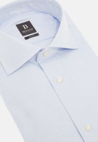 Light blue slim-fit shirt with a small check pattern, featuring a spread collar and two white buttons at the front. Label reads "Boggi Milano."