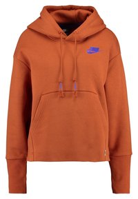 Rostorange cropped hoodie med framficka, blå Nike-swoosh-logotyp på bröstet, och snören med blå ändar.