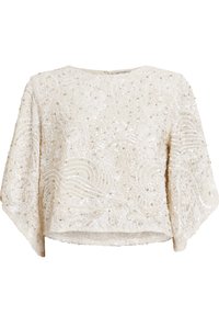 Perlekrafteret creme bluse med rund halsudskæring, brede ærmer og indviklede svungne mønstre med pailletter og teksturerede detaljer.