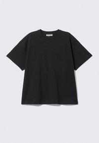 Black oversized t-shirt made of cotton, featuring a crew neckline and short sleeves. Simple design with no patterns or accents.