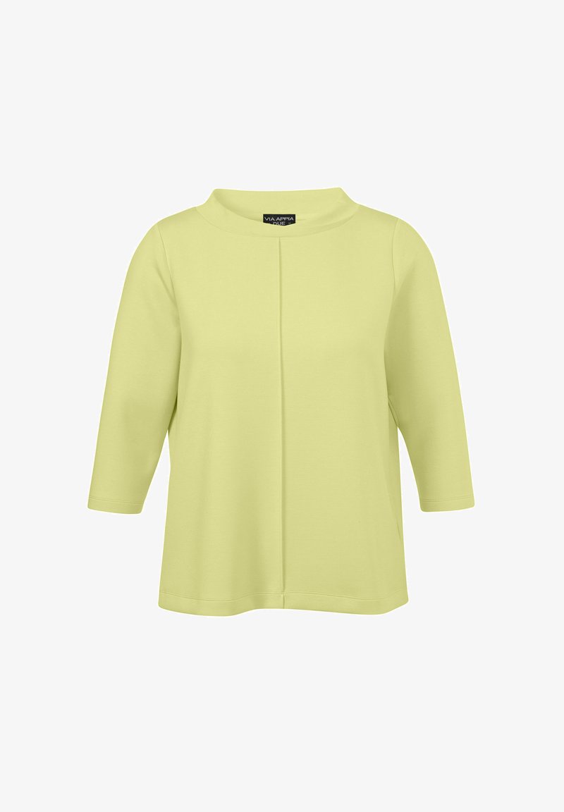 Limegrünes Oberteil mit drei Viertelärmel und rundem Halsausschnitt, das über ein nahtloses Vorderdesign und eine weiche, glatte Textur verfügt.