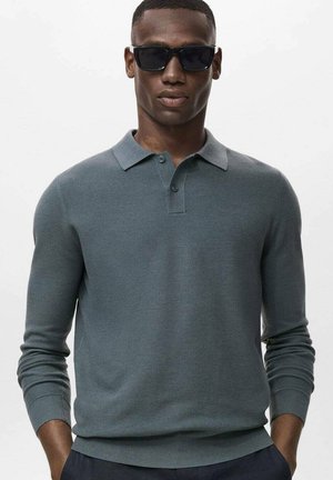 Light gray long-sleeve polo shirt in textured knit fabric, featuring a pointed collar and two-button placket, worn with dark sunglasses.
