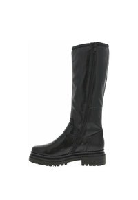 Botte noire en cuir montante avec une fermeture éclair sur le côté, semelle robuste à crampons, design épuré et détails minimaux pour une durabilité et un confort optimal.