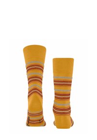 Gelbe Socken mit roten und grauen Streifen. Gerippte Textur am oberen Teil, glattes Gewebe am Körper. Knöchellang mit bequemer Passform.