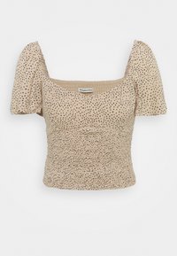 Beige top med korte pufærmer, rynket krop og sort prikkemønster. Firkantet halsudskæring giver struktur. Blødt, tekstureret stof.