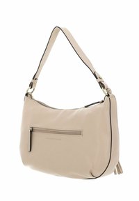 Sac à bandoulière en cuir beige avec une finition lisse, fermeture éclair supérieure, poche avant zippée et détail de bordure noire. Orné d'un pompon.