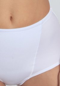 White high-waisted panties made of smooth, stretchy fabric; features seamless edges and a comfortable waistband with subtle stitching details.