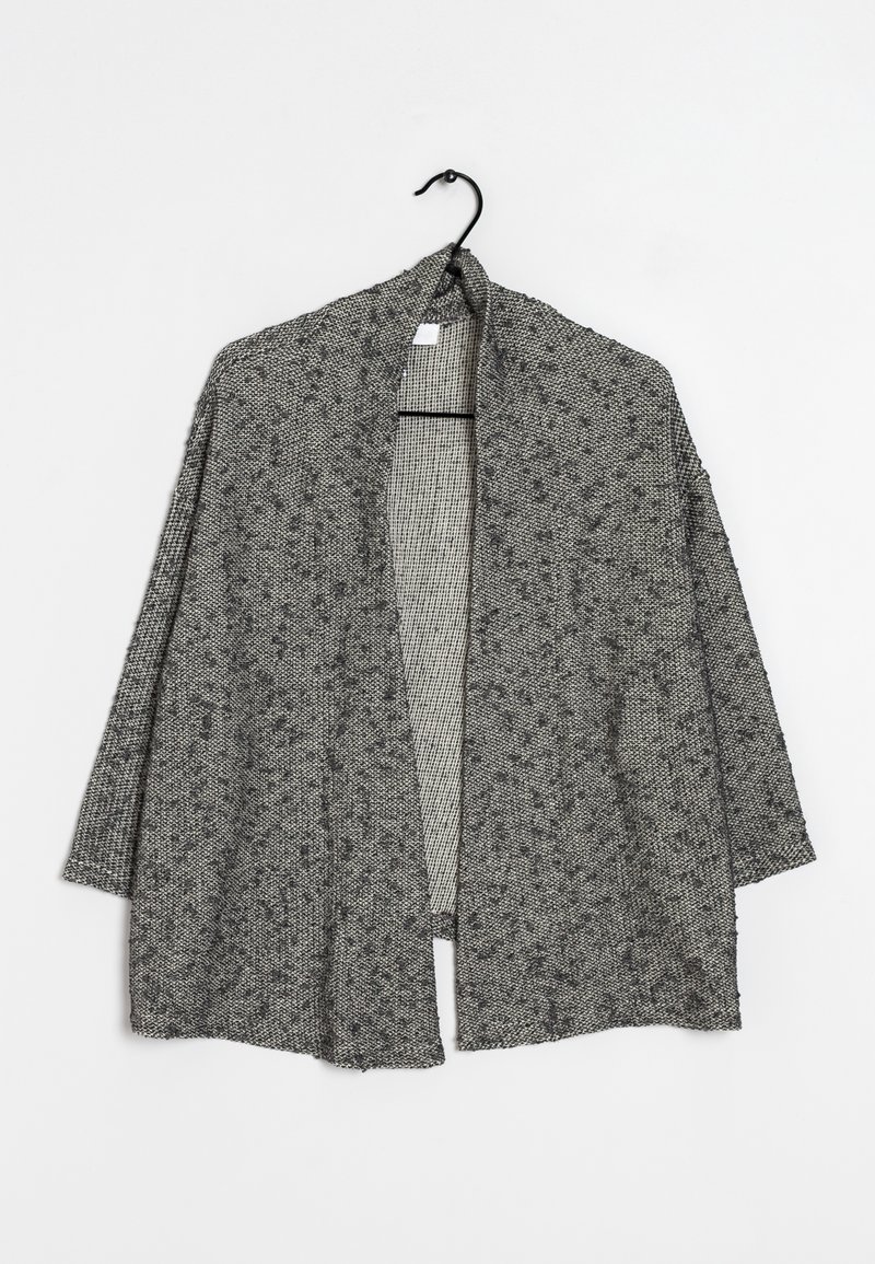 Gray and black textured open-front knit cardigan with three-quarter sleeves hanging on a black hook against a white background.