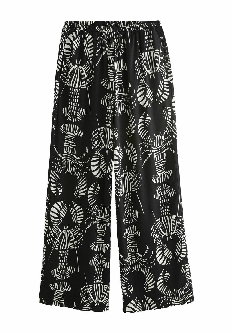 Pantalon large noir avec un motif audacieux de homard blanc et de rayures. Ceinture élastique pour le confort. Tissu lisse et léger.