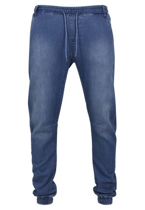 Denim joggers met een elastische tailleband en koord, in een middelblauwe kleur. Voorzien van ribbelmanchetten en een relaxte pasvorm.
