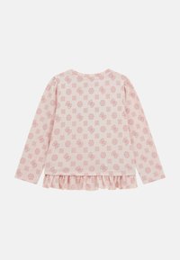 Maglietta a maniche lunghe rosa con motivi floreali, orlo arricciato, colletto rotondo e materiale in cotone morbido. Motivi ripetuti su tutta la stoffa.