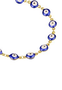 Kuldne kett, millel on vahelduvad sinised ja valged silma kujulised ripatsid, mille keskmes on must punkt, matt viimistlus ja sile tekstuur.