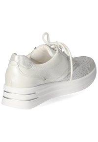 White leather sneaker with a textured silver accent, perforated upper, and a thick, ridged white sole featuring silver stripes.