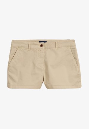 Pantalones cortos casuales beige para mujer con trabillas para cinturón, cierre delantero con botón y bolsillos laterales, mostrados sobre un fondo blanco liso.