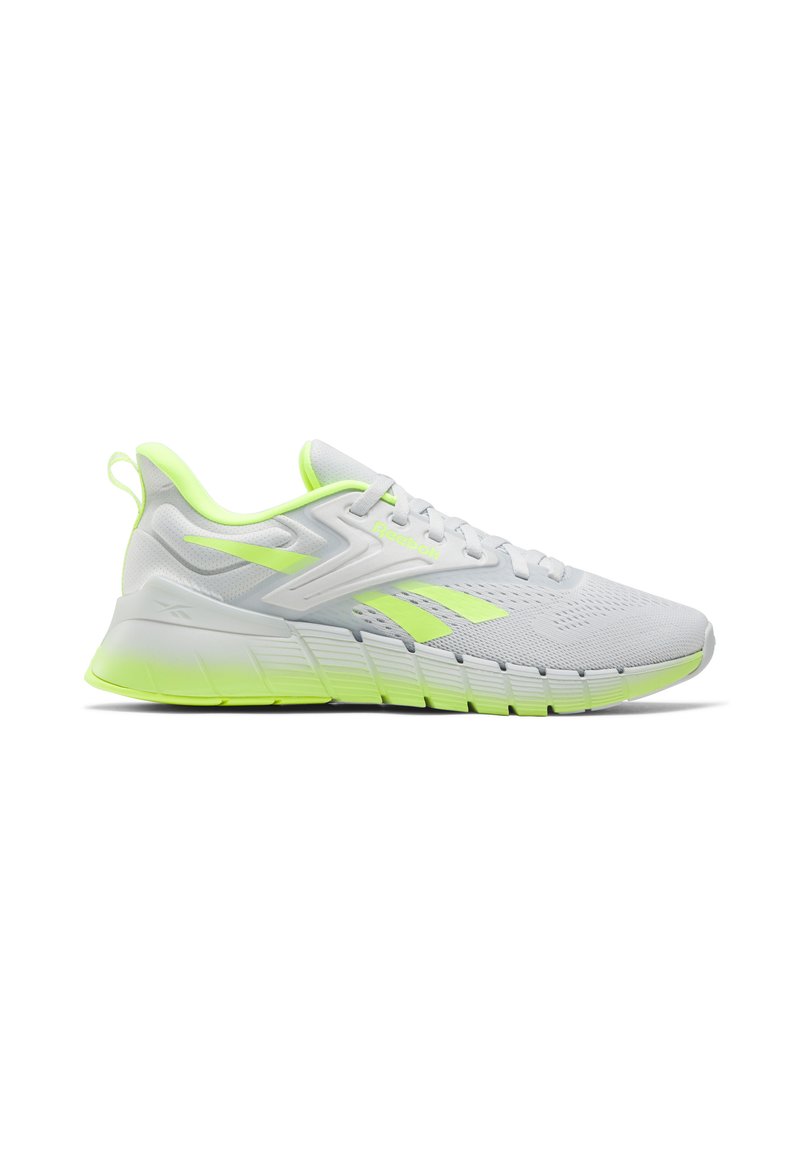 Zapatilla de running Reebok en blanco y verde neón con parte superior de malla, suela acolchada, asa en el talón y cierre con cordones.