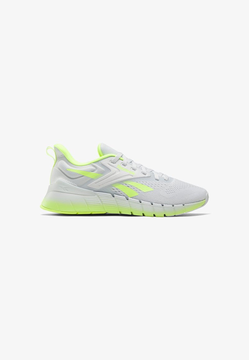 Zapatilla de running Reebok en blanco y verde neón con parte superior de malla, suela acolchada, asa en el talón y cierre con cordones.