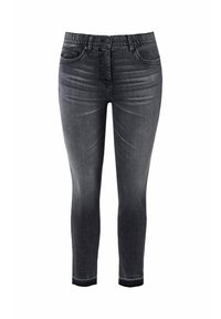 Jeans skinny de denim negro con una textura suave, diseño de cinco bolsillos y una cintura elástica para mayor comodidad. Lavado ligeramente desgastado en los muslos.