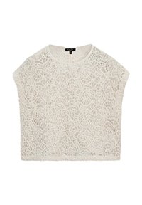 Haut en dentelle blanche à coupe ample, avec un col rond et des manches courtes. Motif floral complexe sur l'ensemble, texture légère.