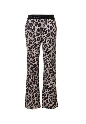Pantalons imprimés léopard avec une coupe large. Ceinture élastique noire portant le mot "BLOCK". Tissu lisse et doux avec des motifs animaliers variés.