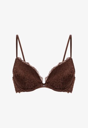 Reggiseno marrone in pizzo con spalline sottili regolabili, coppe imbottite, bordi smerlati e un piccolo fiocco con un ciondolo al centro davanti.