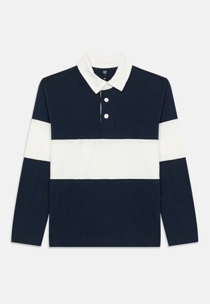 Marine og hvit langermet polo med tre knapper, med horisontale striper. Laget av bomull med kragehals.