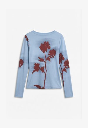 Helehall sinise tooni pikkade varrukatega särk ümara kaelusega, millel on suured tumesinaka punase tooniga lillemustrid esiküljel ja varrukatel.