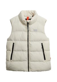 Crème kleurige puffer gilet met hoge kraag, voorzijde met een bidirectionele rits en twee zijzakken met ritssluiting. Voorzien van een logo patch op de borst en een soepele textuur.