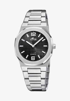 Sidabrinis nerūdijančio plieno laikrodis su aštuonkampiu korpusu, juodu tekstūruotu ciferblatu, dideliais baltais valandų žymenimis ir kvarciniais mechanizmu. Dirželis pasižymi šlifavimo pabaiga.