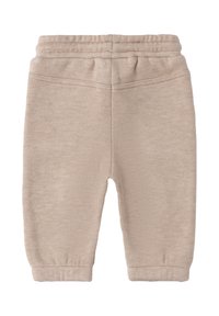 Beige Baumwollsweatpants mit elastischem Bund, zulaufenden Bündchen und einer weichen Textur. Einfaches Design ohne sichtbare Muster oder Akzente.