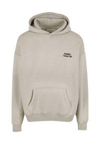 Felpa con cappuccio di un leggero beige, dotata di una tasca frontale e di un piccolo testo nero "Another Cotton Lab" sul lato sinistro del petto.