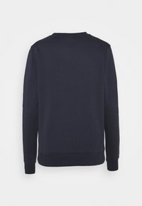 Felpa a maniche lunghe blu navy con collo a giro e polsini e orlo a coste, mostrata da dietro su uno sfondo bianco.