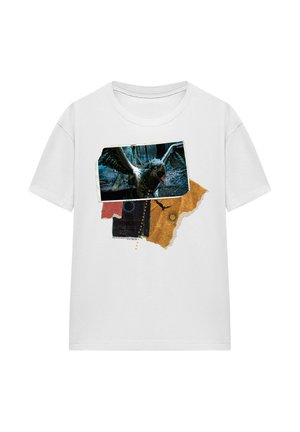 White t-shirt with a graphic of a black bird with open wings over layered torn paper in red, black, and gold colors.