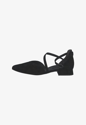 Zapato plano de ante negro con punta afilada, presenta tiras entrecruzadas y un pequeño tacón cuadrado. Textura suave y detalles mínimos.