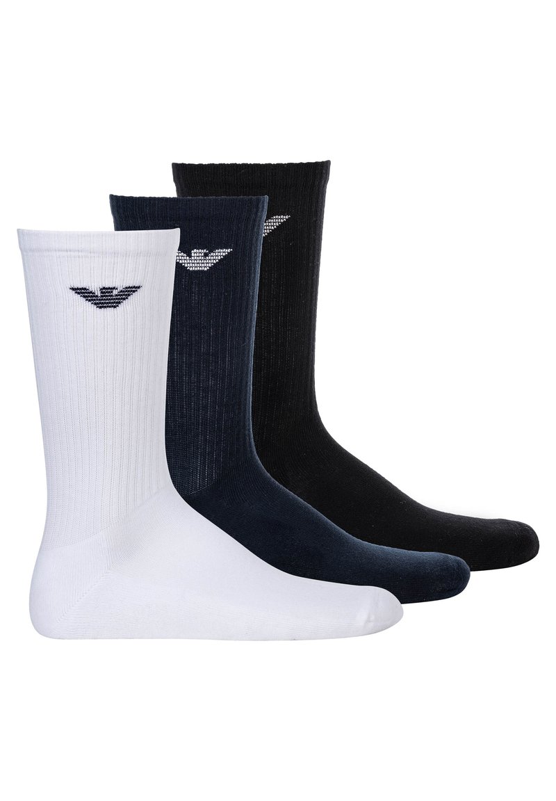 Tre paia di calzini a tubo in bianco, blu scuro e nero. Tessuto a coste con logo sul risvolto. Tessuto morbido, design e lunghezza standard.