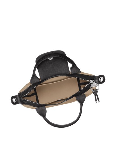 Black leather tote bag with a soft, structured design. Features a zipper closure, a tan interior, and dual top handles. Includes hardware accents.