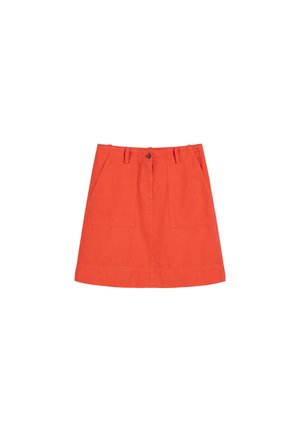 Red cotton skirt with a straight cut, featuring two front pockets, a button closure, and a simple hemline.