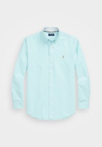 Ljusblå långärmad skjorta med knappar i bomull, med krage och broderad logotyp på vänster bröst.