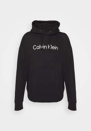 Juodas gobtuvėlis, pagamintas iš medvilnės mišinio. Savybė - priekinė kengūros kišenė ir balta "Calvin Klein" logotipas atspaustas ant krūtinės.