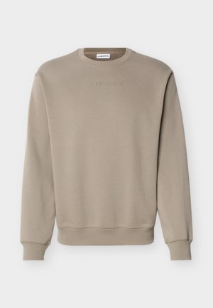 Μπεζ φούτερ με μακριά μανίκια και στρογγυλή λαιμόκοψη, με ριμπ μανσέτες και τελείωμα, με διακριτικό ανάγλυφο λογότυπο "J.LINDEBERG" στο στήθος.