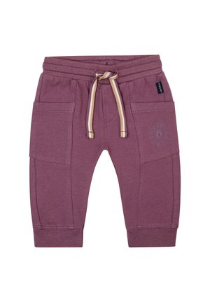 Bordeauxfarbene Jogginghose mit zwei Seitentaschen, elastischem Bündchen und Kordelzug. Mit einem Druckdesign am linken Oberschenkel. Weiches Baumwollmischmaterial.