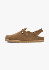 Brown suede clogs with a round toe, adjustable strap, and rubber sole. Features simple design and textured material for comfort.
