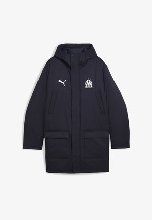 Laivastonsininen Puma pitkä takki hupulla, kahdella etukannellisella taskulla ja Marseillen jalkapalloseuran logolla rinnassa.