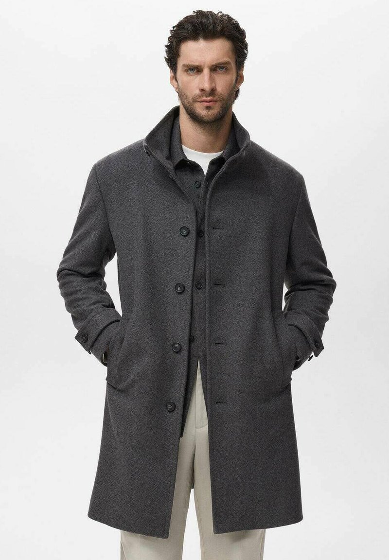 Dark grey wool coat with a collar, button closure, two front pockets, and a soft texture. Features straight cut and tapered sleeves.