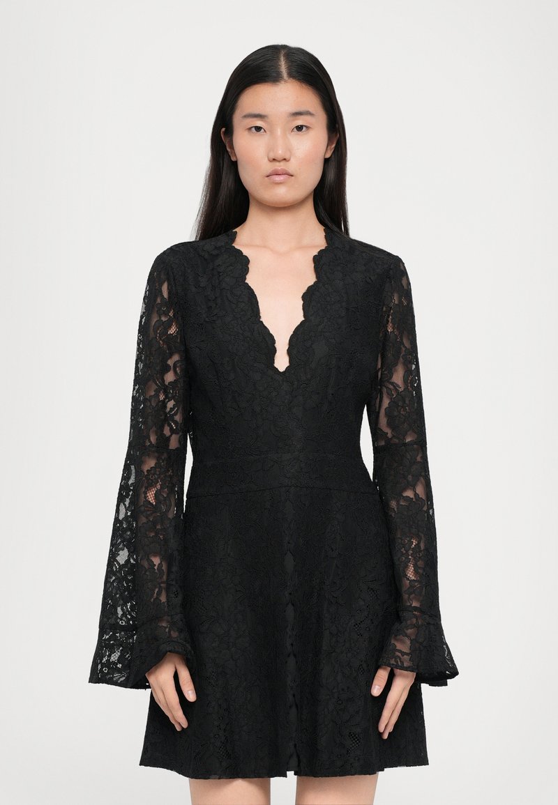 Black lace dress featuring long bell sleeves, a deep V-neckline, and an A-line silhouette. The lace has floral patterns and a textured finish.