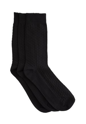 Drei Paar schwarze Socken mit geripptem Design und einfarbigem Look. Der Baumwoll-Mischstoff bietet Komfort und Haltbarkeit.
