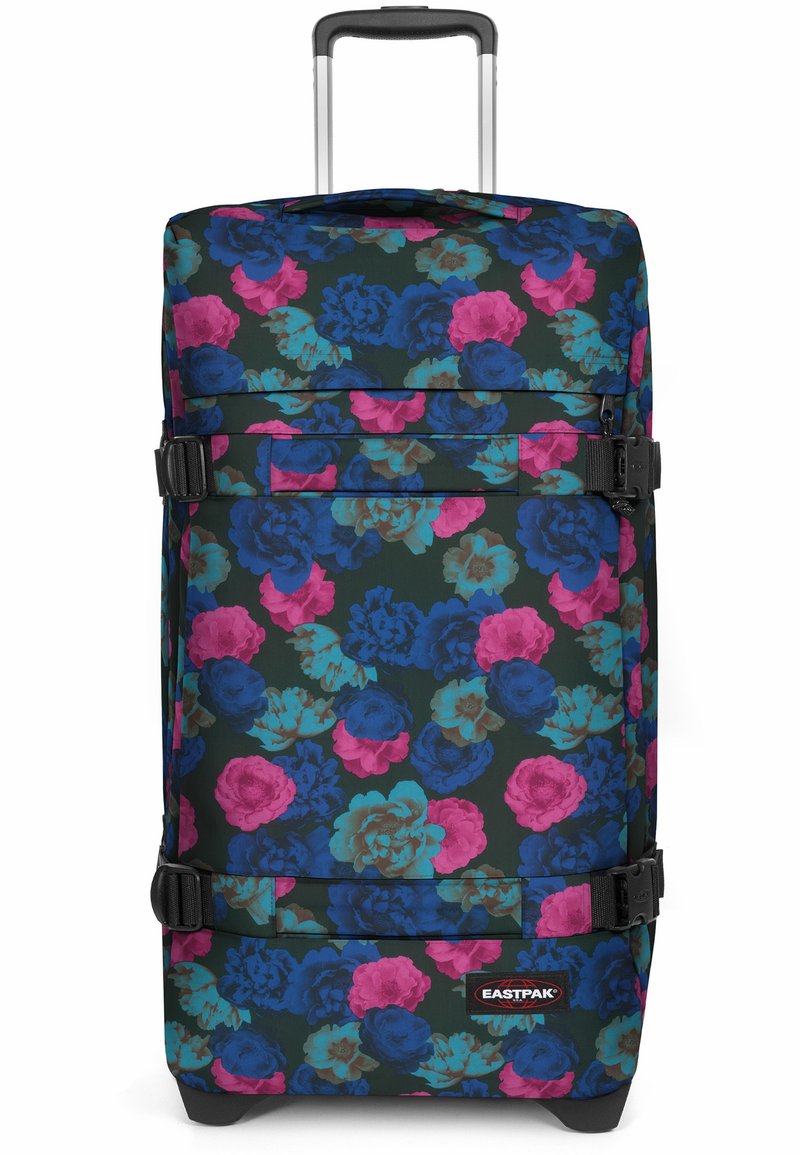 Svart resväska med blommönster i blått, rosa och grönt. Har två justerbara remmar, en logopatch och ett utdragbart handtag.