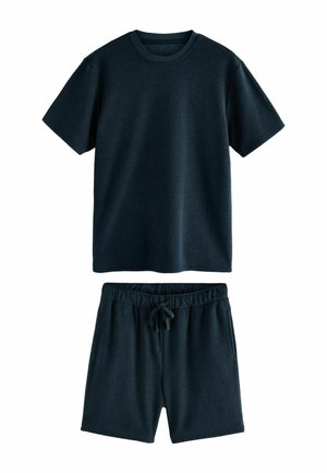 Dunkelblaues Lounge-Set bestehend aus einem kurzärmeligen T-Shirt und Shorts mit elastischem Bund. Weiche Textur, legeres Design, mit Kordelzug an den Shorts.