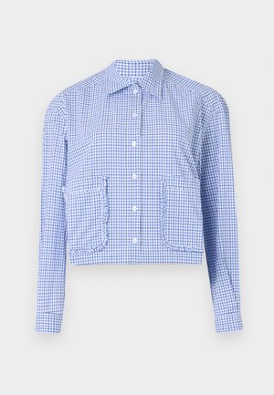 Cropped blue and white checkered shirt, long sleeves, button front, ruffle-accented pockets, structured collar, smooth cotton fabric.