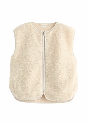 Veste sans manches en sherpa beige avec col rond et fermeture zippée devant, présentant un tissu doux et texturé ainsi qu'un ourlet légèrement arrondi.